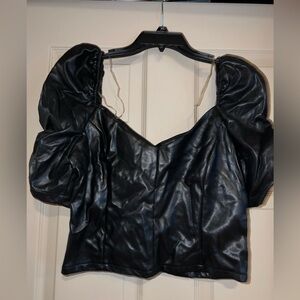 Cropped leather top with dramatic sleeves